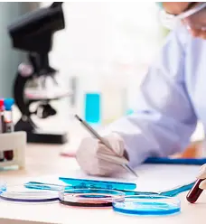 scientist recording lab test results