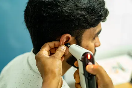 ear examination with otoscope