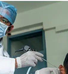 ent doctor performing ear endoscopy