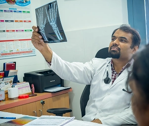Orthopedic doctor examining X-ray